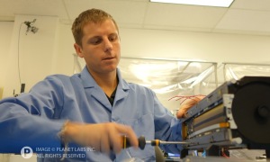 A Planet Labs Engineer Working on a Dove at the factory